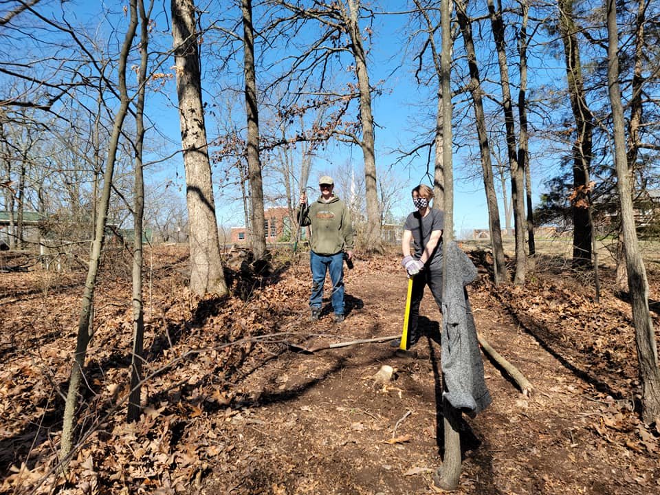 Ethan Beattie and his father, Mike Beattie, who are members of St. Robert Bellarmine Parish in St. Robert, work on Ethan’s Eagle Scout project, now known as the St. George Meditation and Nature Trail prior to its completion in December.